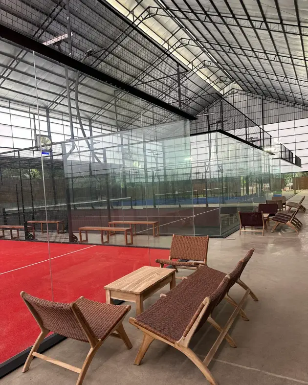 Red court with timber lounge chairs